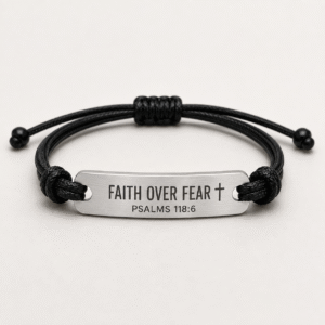 AI visualization of a black cord bracelet with FAITH OVER FEAR cross and PSALMS 118:6 message bar