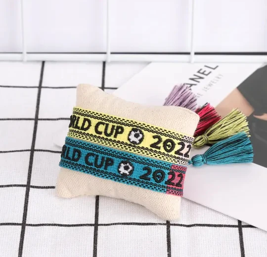 Actual ZM40 football themed catalog bracelets with soccer ball motifs and WORLD CUP 2022 wording